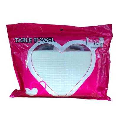 Table Tower - La toalla esencial para profesionales de uñas y pestañas